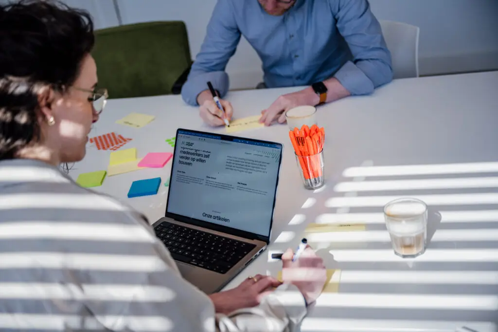 MBTI Judging Perceiving Two people writing on post its